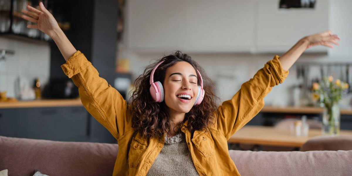 Fangirl listening to music on her couch
