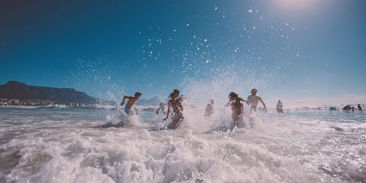 Friends playing in the ocean waves