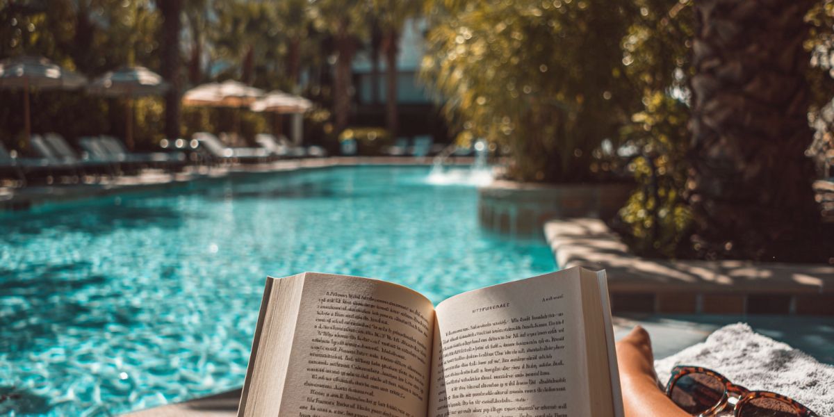 Reading a book at the pool